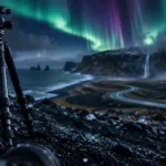 Voyage Islande aurore boréale periode, trépied et aurores sur sable noir